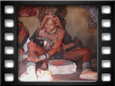 Opuwo - Himba village - Covering with otjize paste
